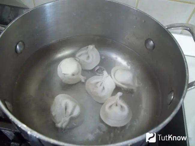 Dumplings added to the broth