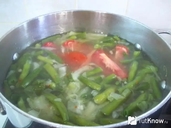 Tomatoes added to the pot