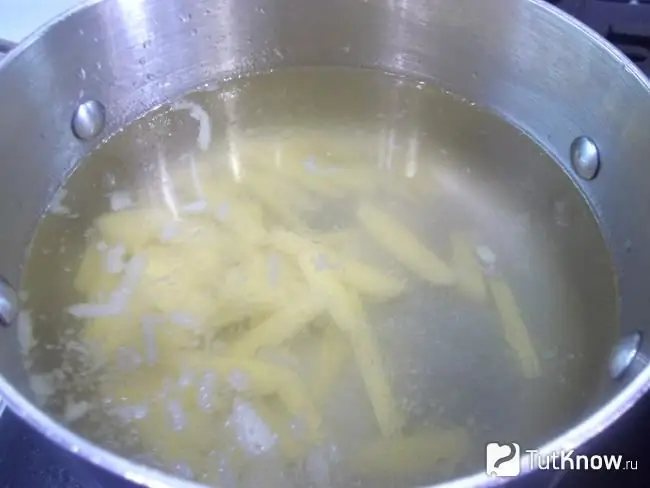 Potatoes are boiled in a saucepan