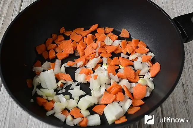 Carrots and onions in a pan