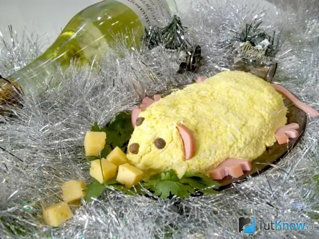 Garlic salad of beets and cheese for the New Year 2020 decorated in the shape of a Rat