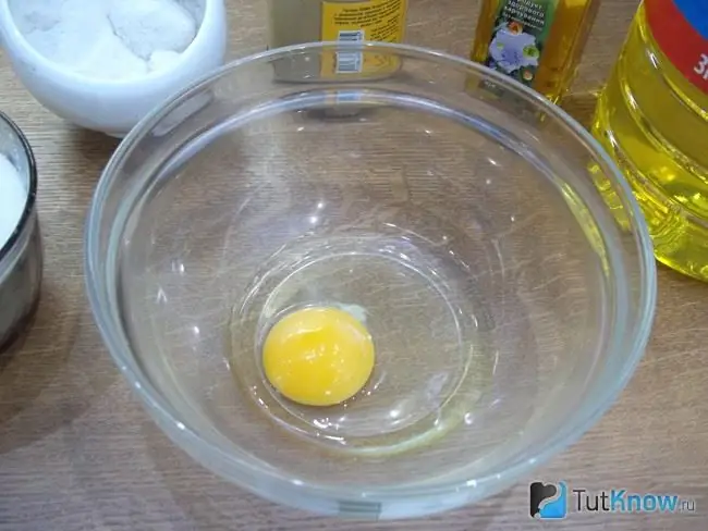 The egg is hammered into a container