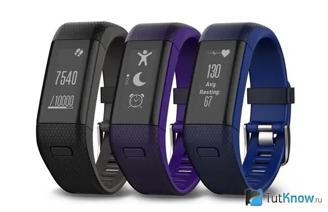 Three fitness trackers on white background