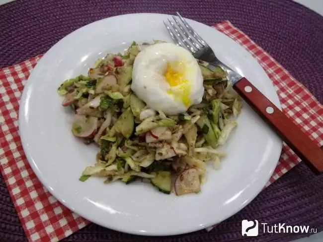 Ready-made vegetable salad with canned mackerel and poached egg