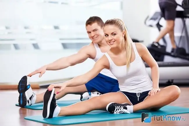 The guy and the girl are doing fitness