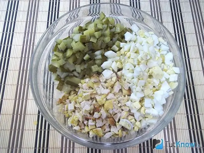 Eggs boiled, peeled, chopped and added to a salad bowl