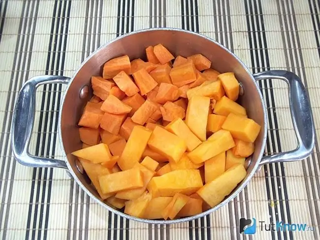 Pumpkin and carrots are chopped and boiled in a saucepan