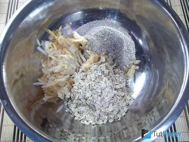 Apple, bran and cereal combined in a bowl