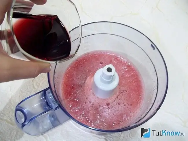 Wine is poured into the crushed watermelon mass