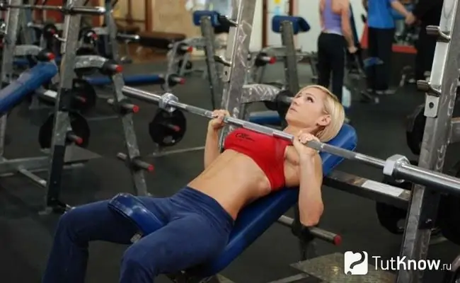 Woman Powerlifter Performing Bench Press