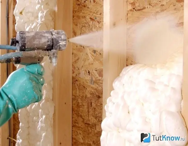 Spraying liquid foam on the wall