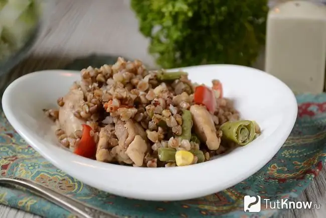 Buckwheat with chicken and vegetables in a pan