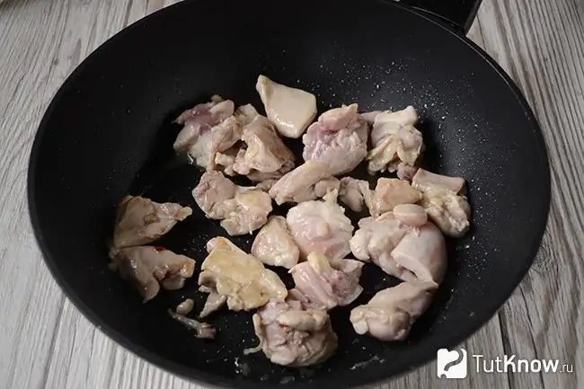 Pieces of chicken in a pan