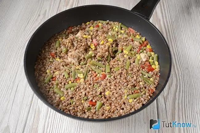 Ready buckwheat with chicken and vegetables in a pan