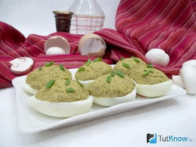 Ready eggs stuffed with mushrooms