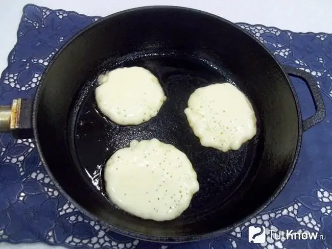 Fritters are fried in a pan