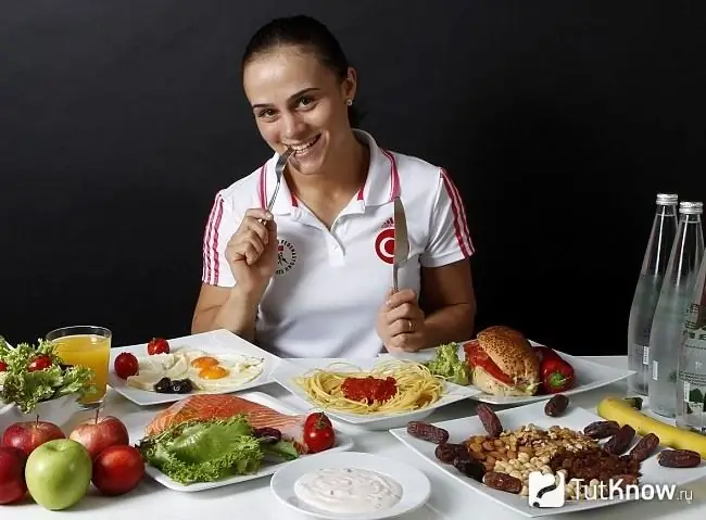 Sportswoman eating