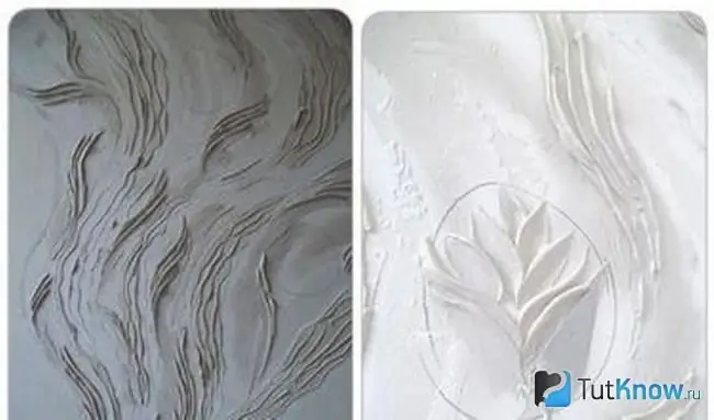 Leaves and flower are drawn on plaster