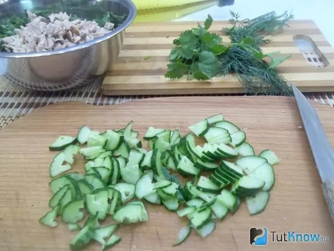 Cucumbers are cut into half rings