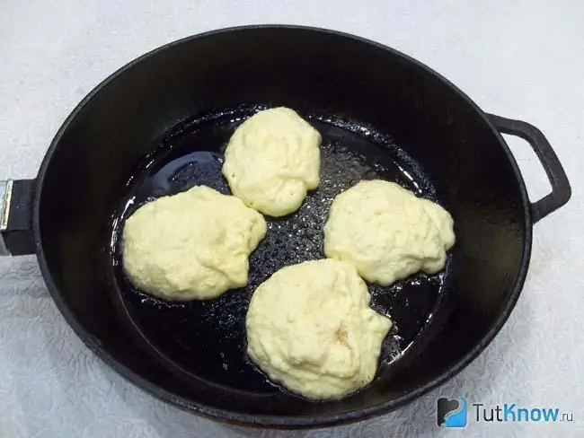 Fritters are fried in a pan