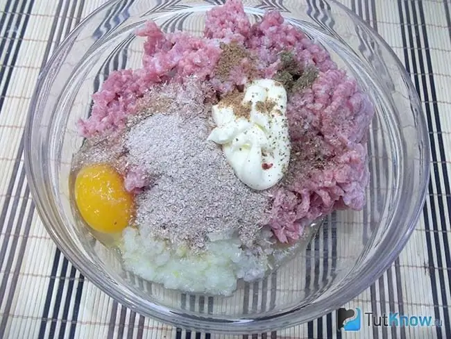 Egg and spices added to the minced meat