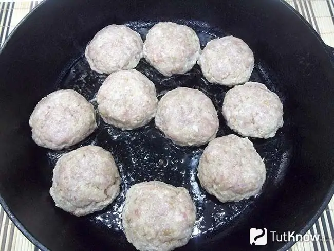 The meatballs are fried in a pan