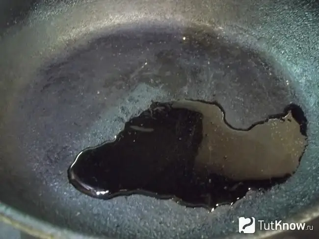 Oil is poured into the pan