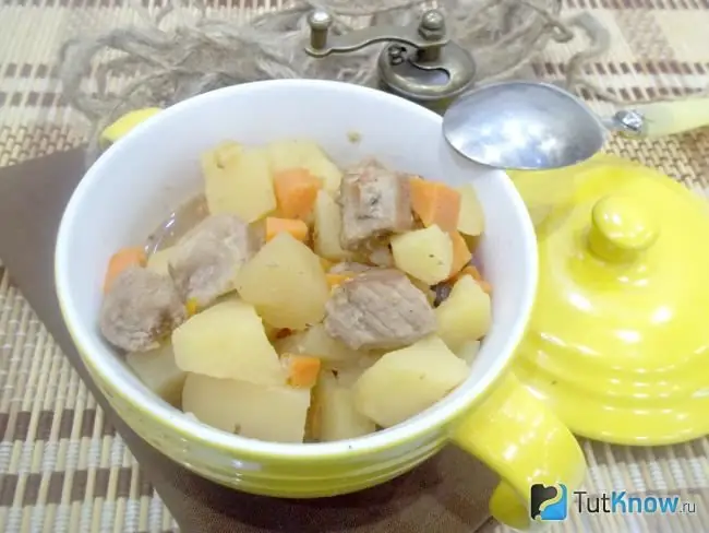 Ready veal with potatoes and carrots in spices with adjika