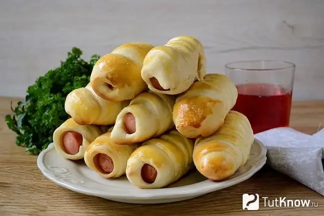 Sausages in yeast dough on a plate